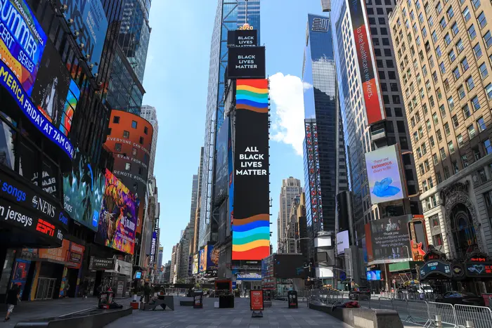 A screen says "All Black Lives Matter" with rainbow colors around it